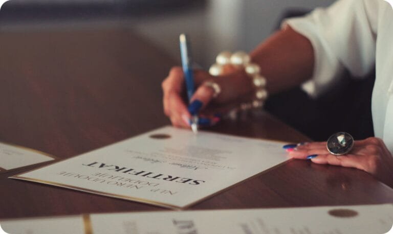 CMA vs CPA 회계사 자격증 비교: 연봉, 경력, 차이점 (2026 업데이트) 6 a woman signing on a professional certificate